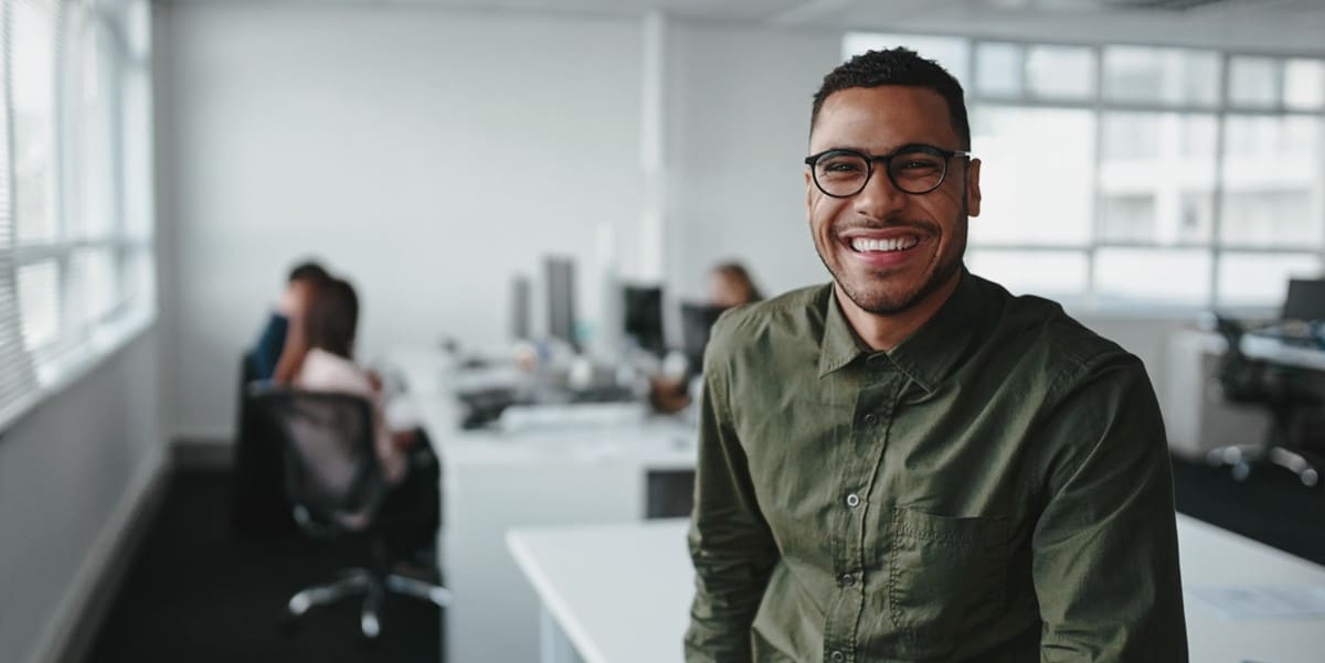 man smiling in office