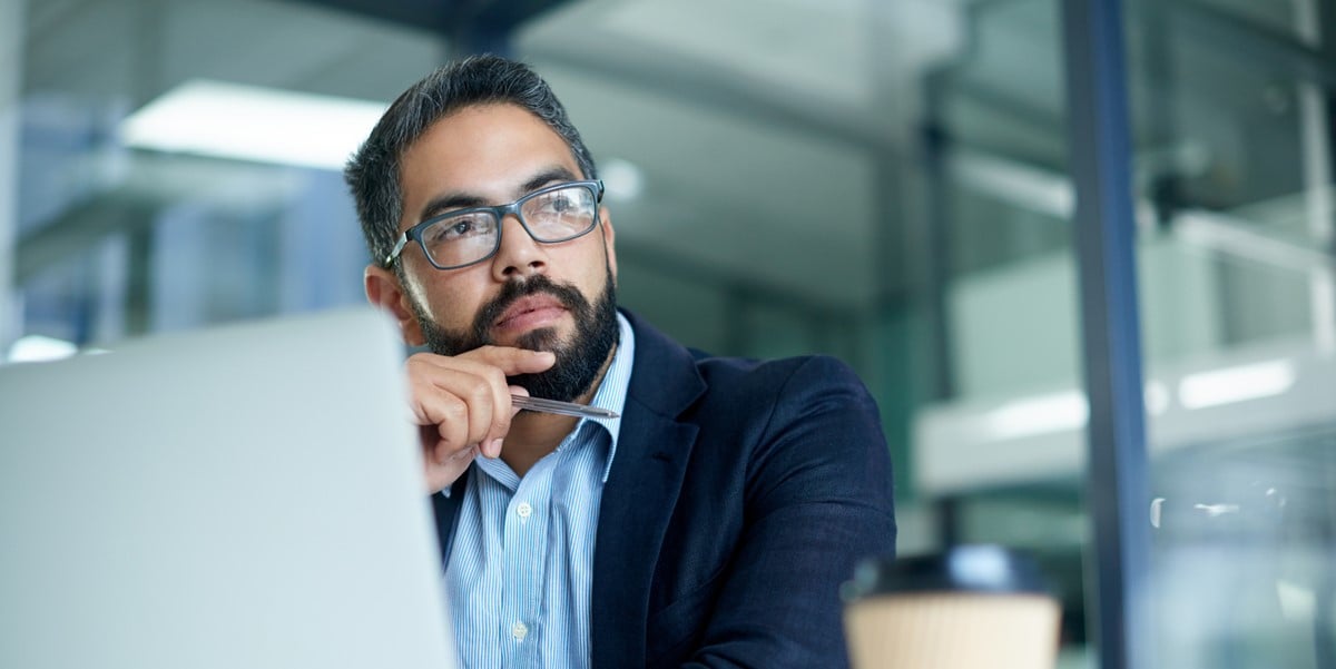 man in office working at desk